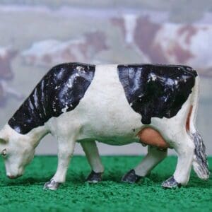 SOLD Timpo Black-and-White Feeding Cow - Early Paint!