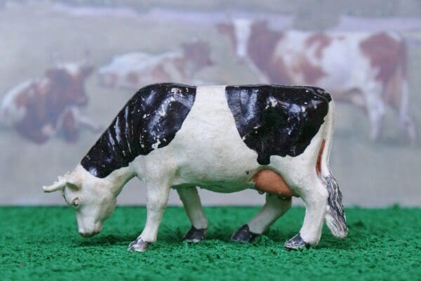 SOLD Timpo Black-and-White Feeding Cow - Early Paint!