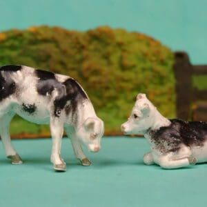 SOLD Black Stencil-sprayed Calves Feeding & Lying