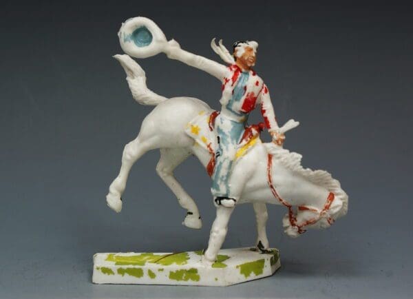 SOLD Cherilea 60mm Rodeo Cowboy on Bucking Bronco
