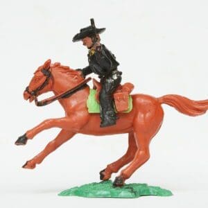 SOLD Timpo Solid Plastic Mounted Cowboy Firing Twin Guns