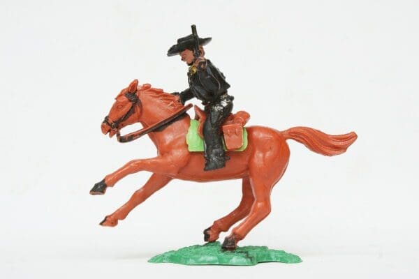 SOLD Timpo Solid Plastic Mounted Cowboy Firing Twin Guns