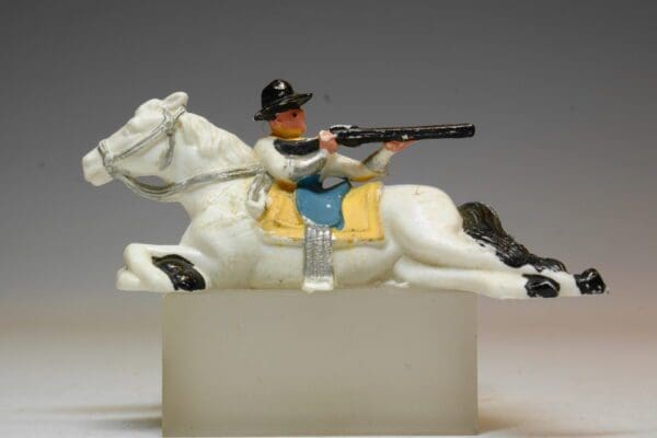 SOLD Hilco Plastic Cowboy Firing from behind Lying Horse