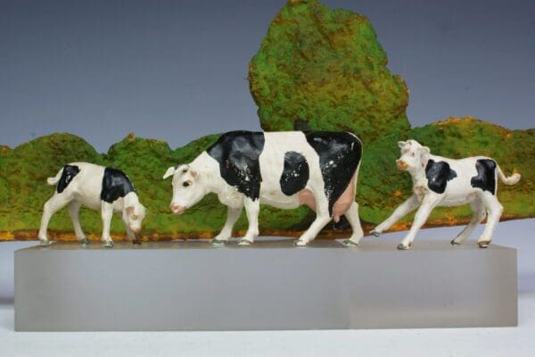 SOLD Herald Cow Feeding and 2 Calves (Friesians)
