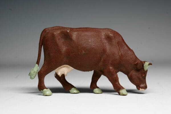 SOLD Britains Cow Feeding Brown PVC
