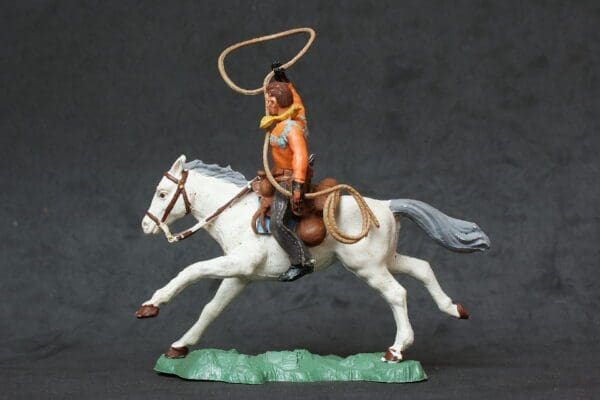 SOLD Herald Swoppet Mounted Cowboy with Lasso (Yellow Torso)
