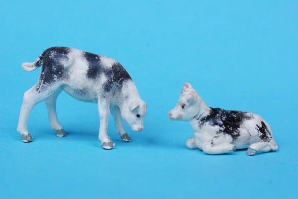 SOLD Black Stencil-sprayed Calves Feeding & Lying