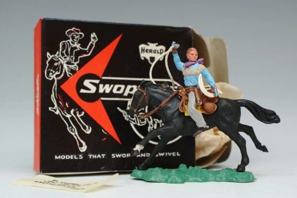 SOLD Herald Swoppet Cowboy Throwing Lasso Mounted